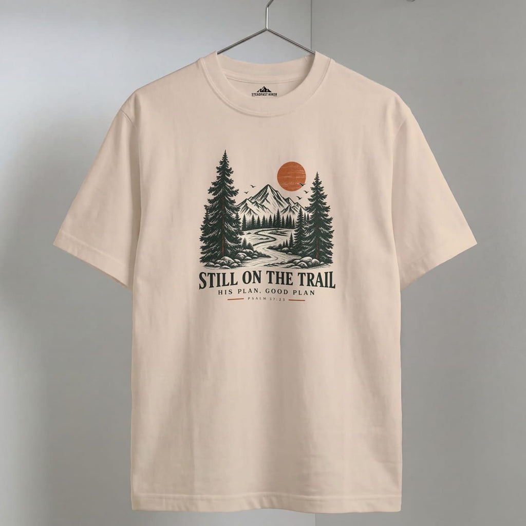 Ivory Still on the Trail T-shirt featuring a vintage mountain graphic inspired by Psalm 37:23