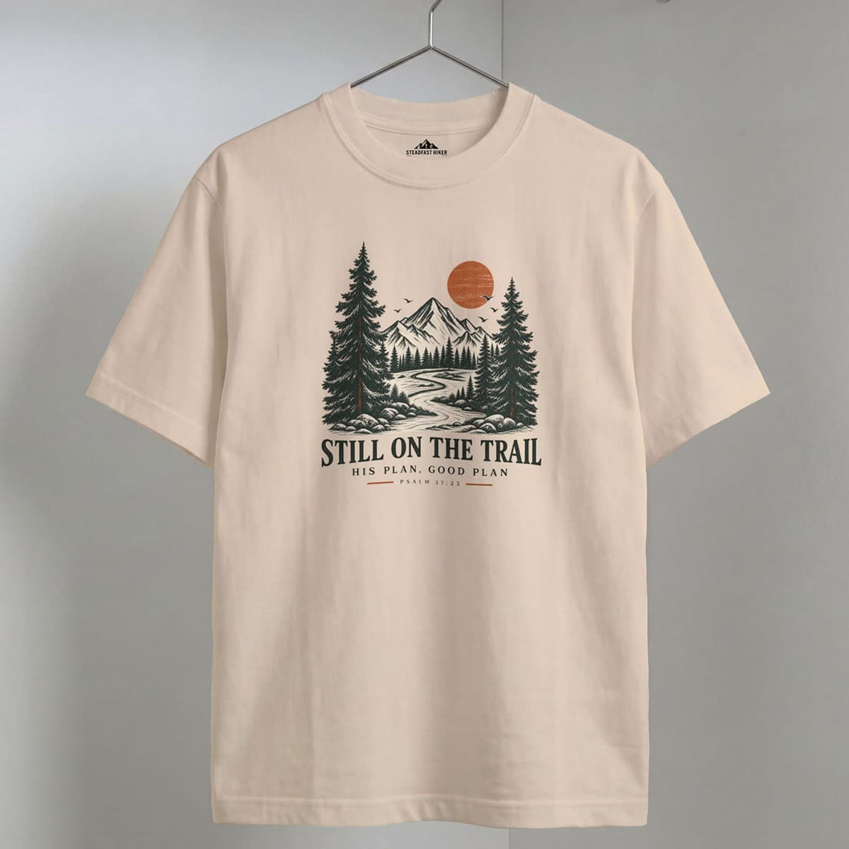 Ivory Still on the Trail T-shirt featuring a vintage mountain graphic inspired by Psalm 37:23