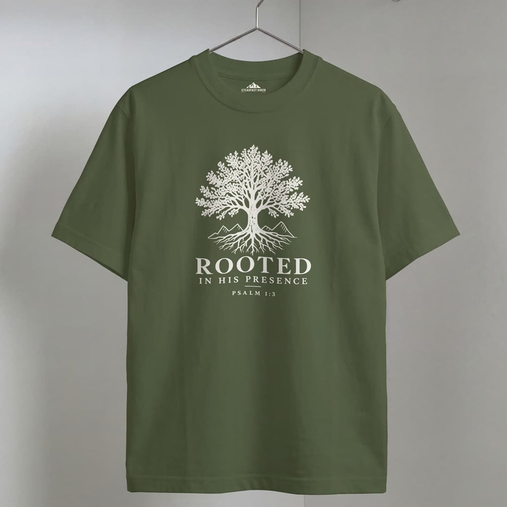 Sage Rooted Christian hiking t-shirt on a wooden hanger