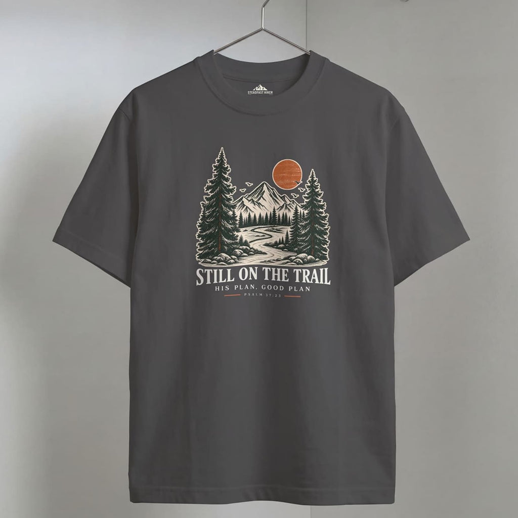 Grey Still on the Trail T-shirt featuring a vintage mountain graphic inspired by Psalm 37:23.