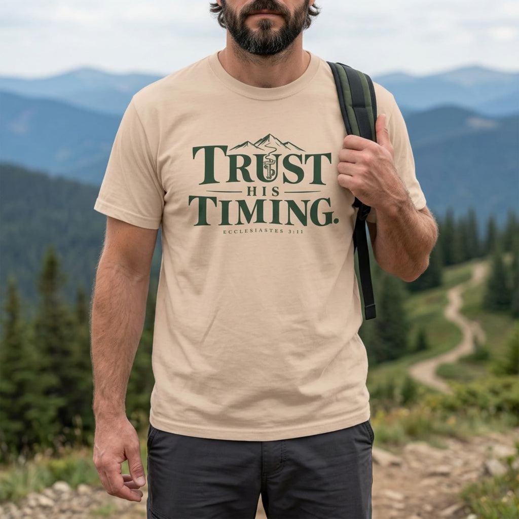 Man wearing an Ivory Trust His Timing Christian hiking t-shirt outdoors, Ecclesiastes 3:11