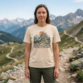 Woman hiking in an Ivory Who Shall Ascend Christian t-shirt on an alpine trail