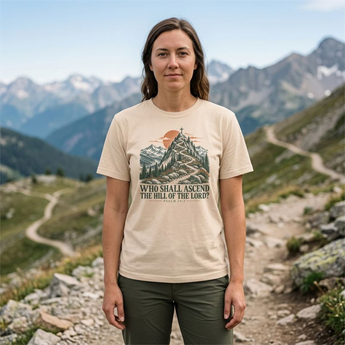 Woman hiking in an Ivory Who Shall Ascend Christian t-shirt on an alpine trail