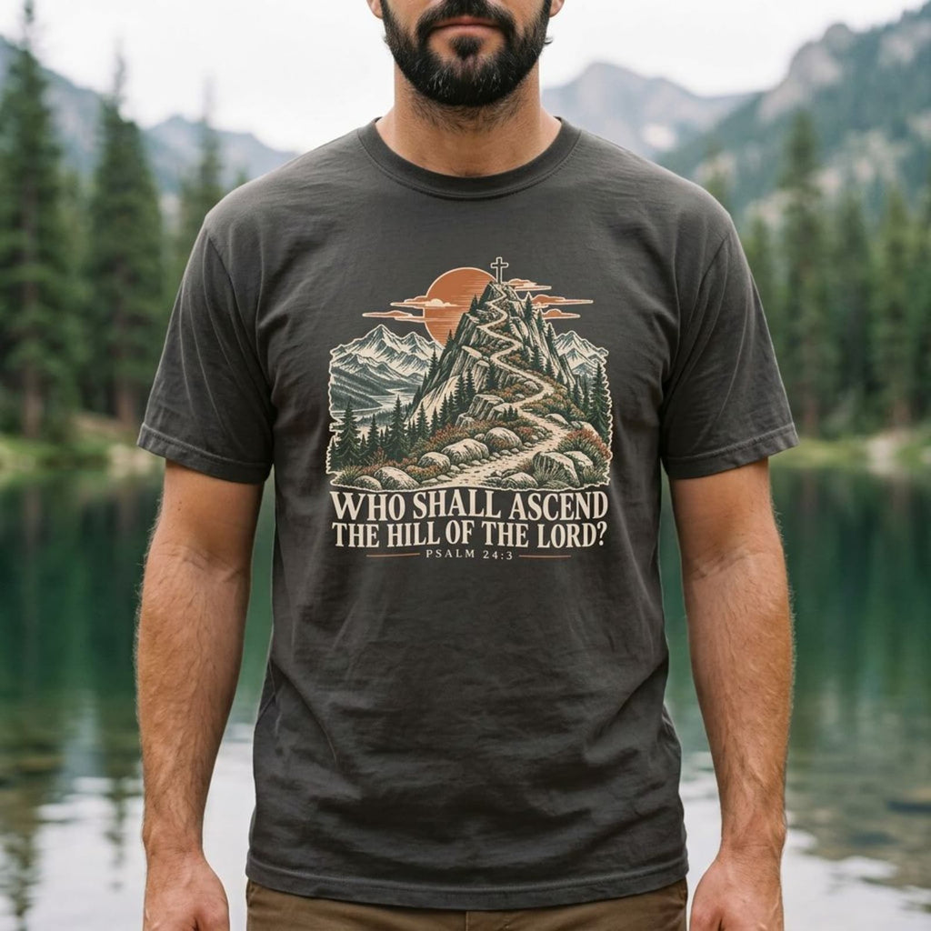 Man wearing a Pepper Who Shall Ascend Christian hiking t-shirt by an alpine lake, Psalm 24:3